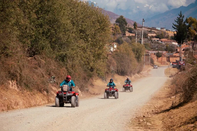 Tourists riding quad bikes during the ATV Maras Moray tour in the Sacred Valley near Cusco