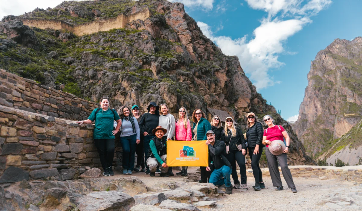 Tour group among the stone ruins of Ollantaytambo