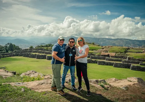 Travelers beside Inca stone terraces near Cusco