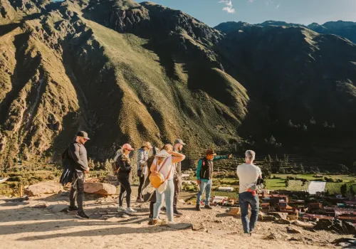 Visitors walking through the Inca ruins of Ollantaytambo
