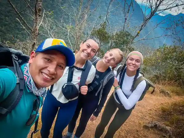 four smiling people on peru guided tours