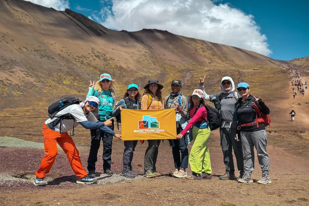 Hikers trekking the Rainbow Mountain trail in Cusco Peru