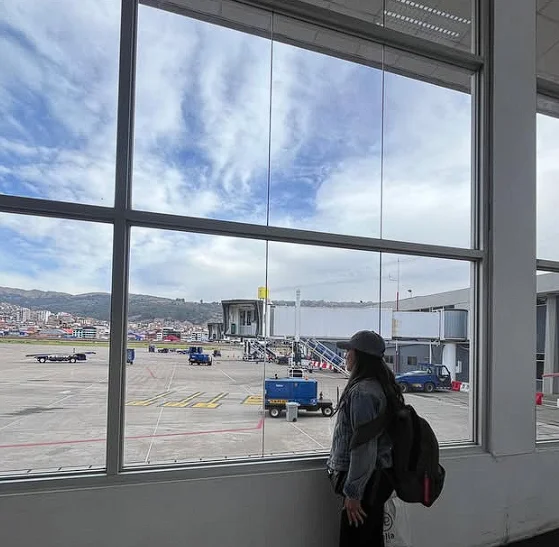 Airline check-in counters inside Cusco Airport main hall