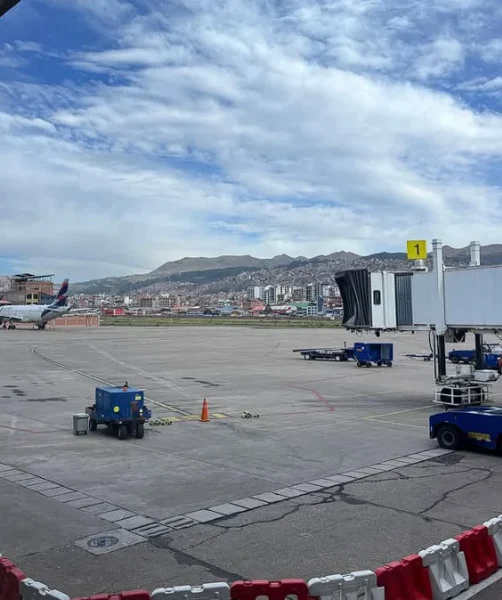Travelers waiting at Cusco Airport departures gate
