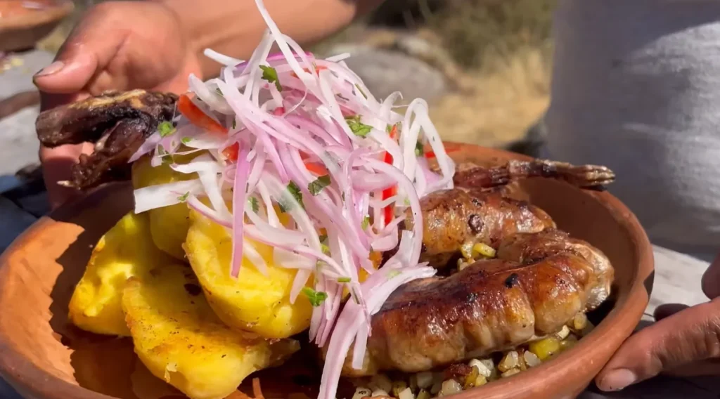 A traditional Peruvian dish cuy chactado with side dishes