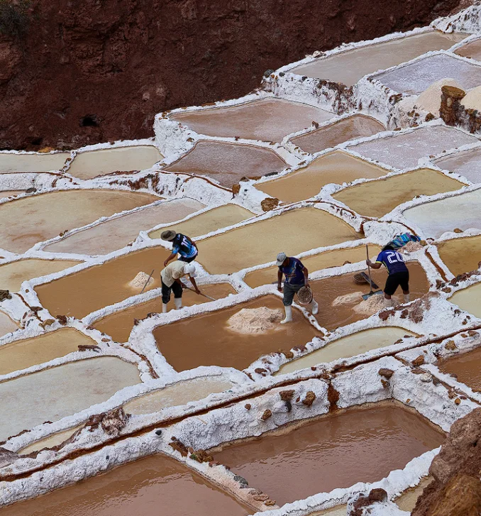 Salt harvesting at the Maras Moray salt flats in Cusco
